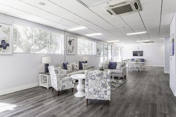 Bright common area with seating and natural light