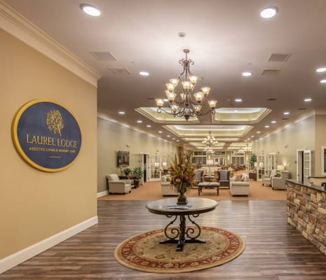 Lobby interior of Laurel Lodge showcasing a decorative chandelier and seating areas