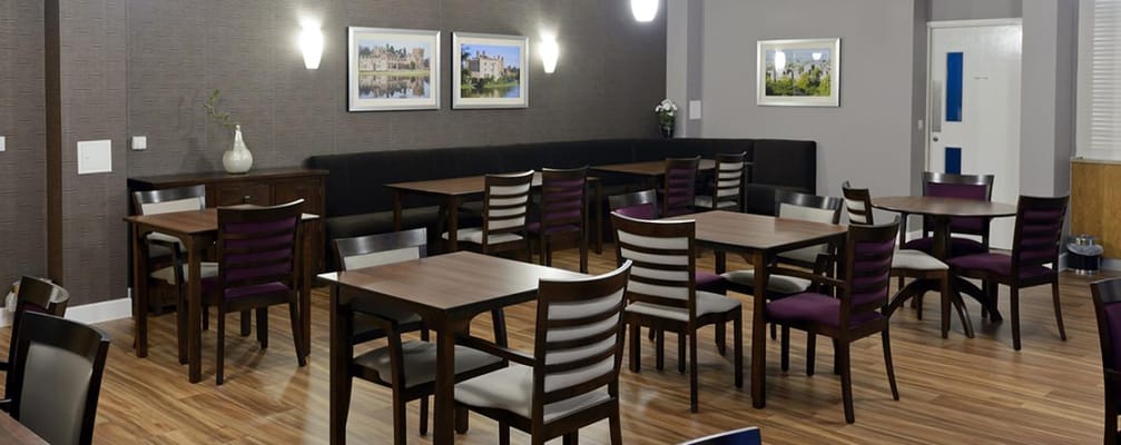 Dining room with tables and chairs in an indoor setting