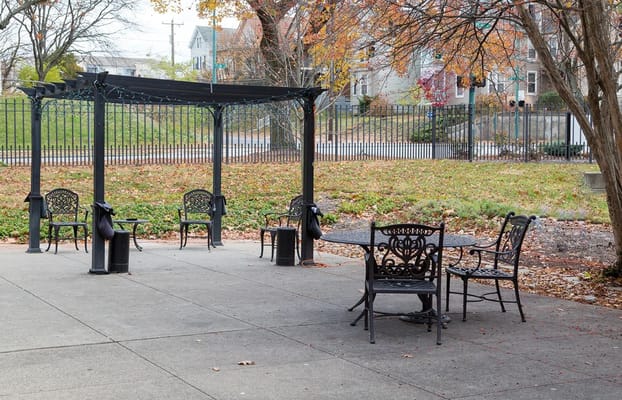 Outdoor seating area with black metal chairs