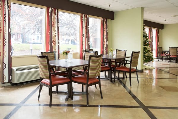 Dining area with tables by large windows