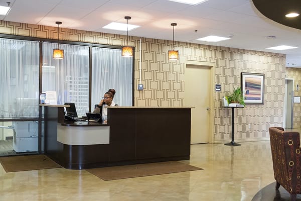 Reception area with staff member at the desk