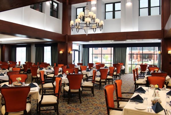 Elegant dining room with tables set for a meal