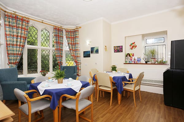 Bright dining area with tables and chairs