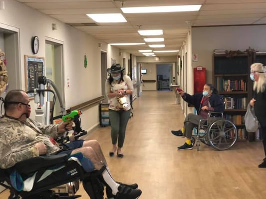 Residents engaging in an activity in the hallway