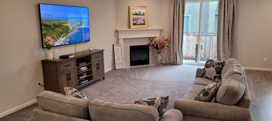 Cozy common area with modern furniture and a TV