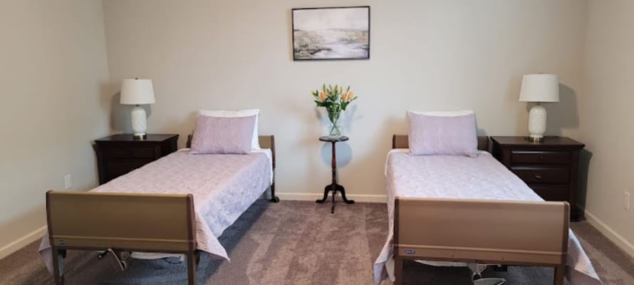 Private resident room with two beds and decorations