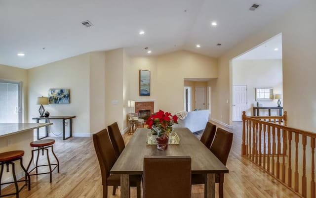 Bright common area with dining table and seating