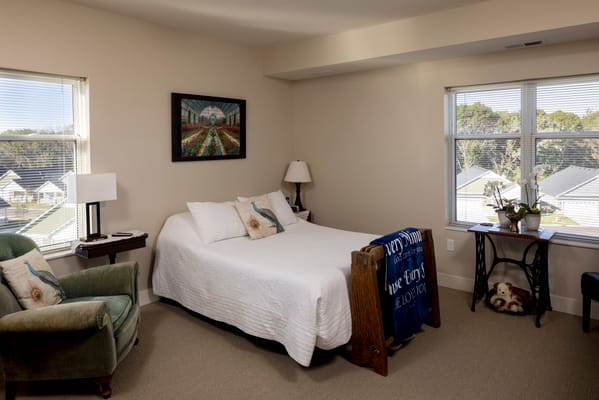 Well-furnished resident room with natural light