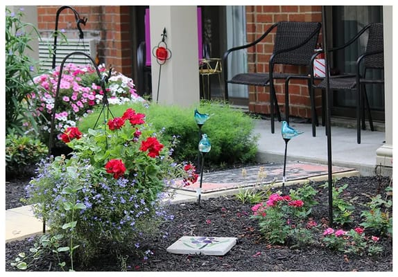 Outdoor garden space with flowers and seating