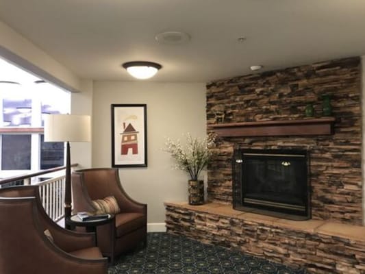 Cozy common area with seating and fireplace