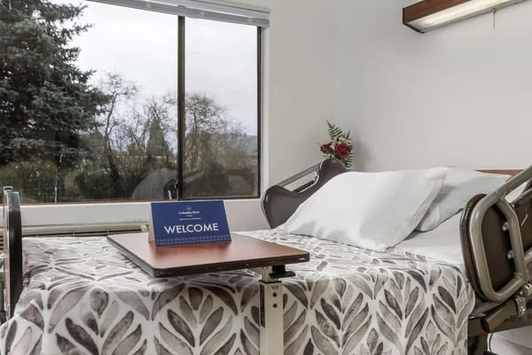 A well-prepared resident room with a welcome sign