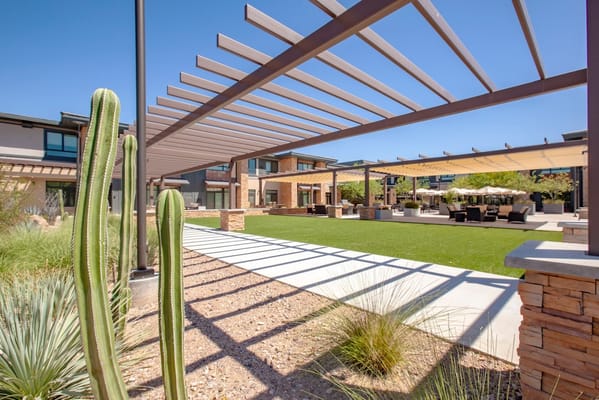 Outdoor patio area with seating and landscaping