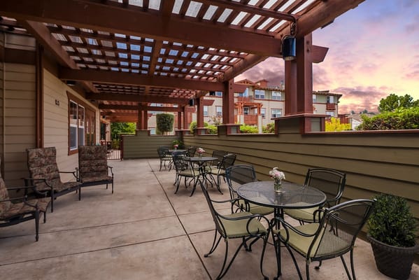 Outdoor seating area with tables and chairs