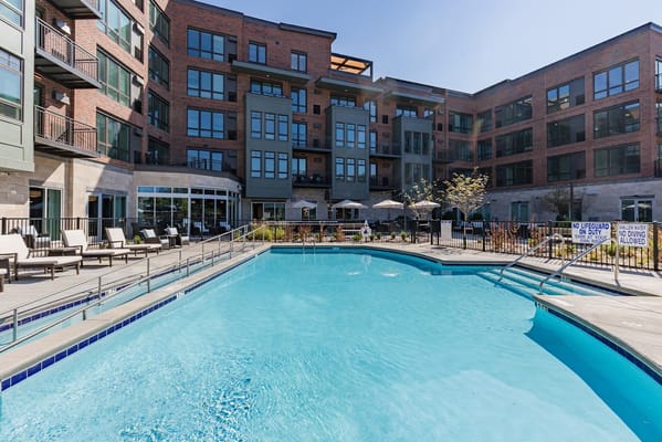 Outdoor pool area with lounge chairs