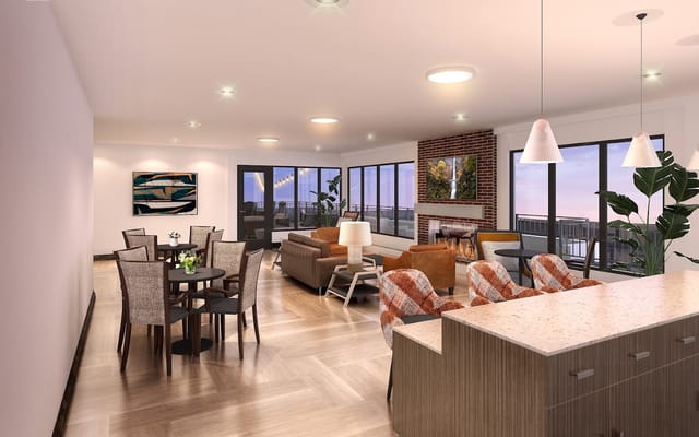 Bright common area with seating and large windows