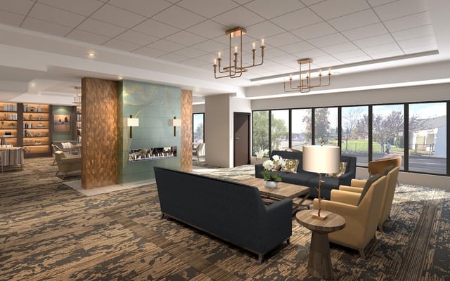 Bright and spacious common area with seating and windows