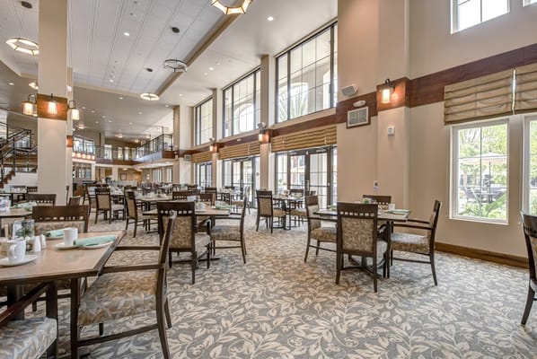 Bright dining area with tables and chairs