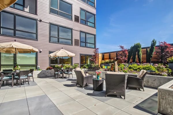 Outdoor seating area with garden at the facility