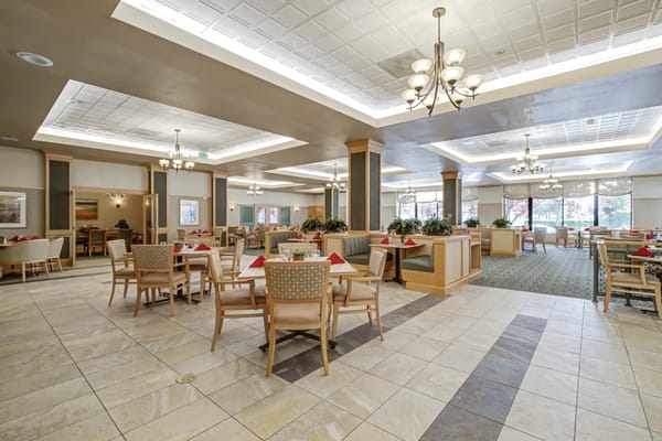 Dining room with tables set and natural light