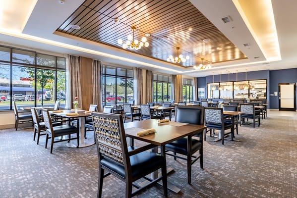 Bright dining room with modern decor and ample seating