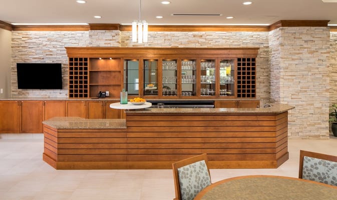 Interior view of a common area with a bar and seating