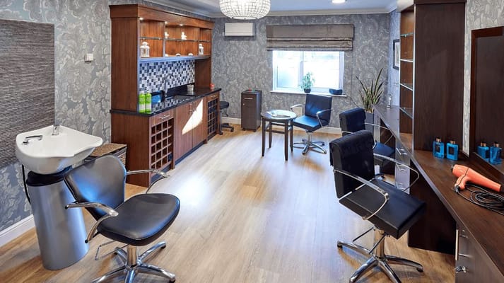 Interior view of the facility's salon area with styling chairs