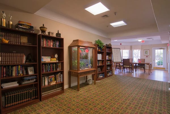 Interior view of a cozy common area with bookshelves