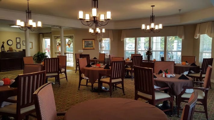 Dining room with tables set for residents