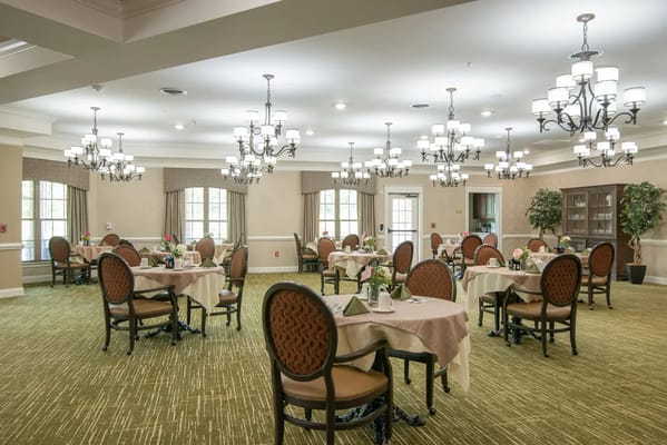 Dining room setup with tables and chairs