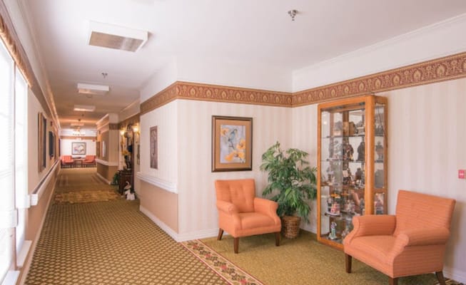 Warm and inviting interior hallway with seating
