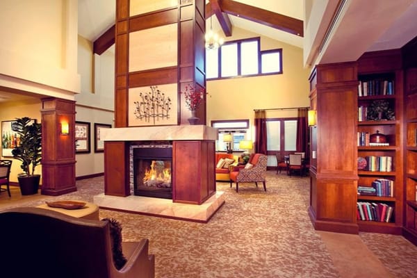 Bright common area with comfortable seating and fireplace
