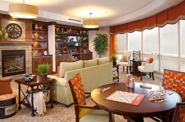 Common area with seating and games in a cozy environment