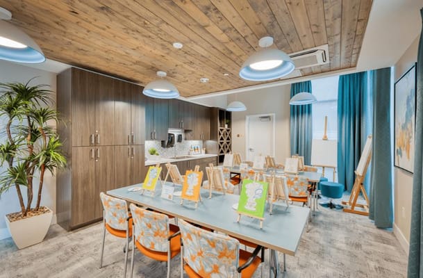 Activity room with art supplies and easels set up