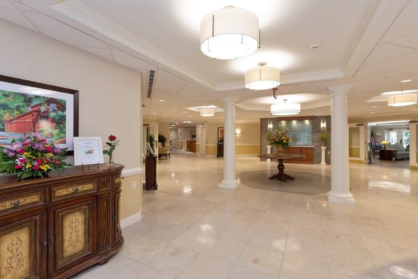 Welcoming lobby area with decorative flowers and polished floors
