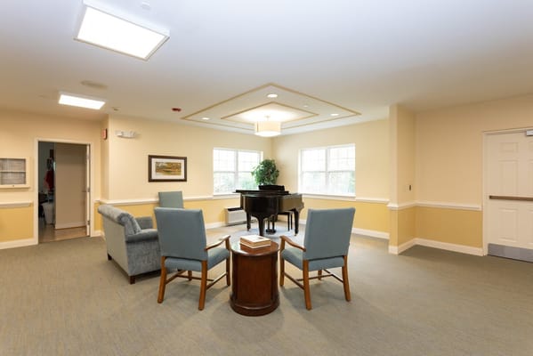 Cozy lounge area with a piano and seating