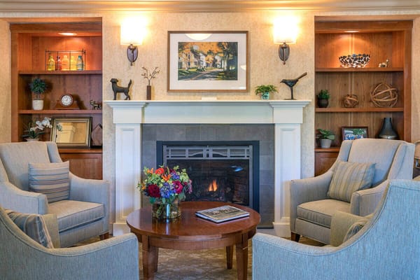 Cozy common area with comfortable seating and a fireplace