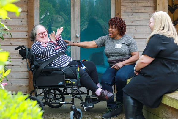 Residents and staff enjoying time outdoors together