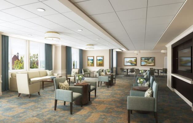 Bright common area with seating and artwork.