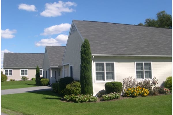 Building exterior of assisted living facility with landscaping