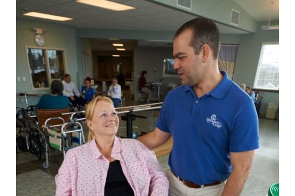Staff member interacting with a resident in a common area