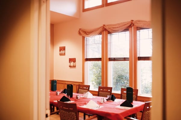 Dining area with neatly arranged table settings
