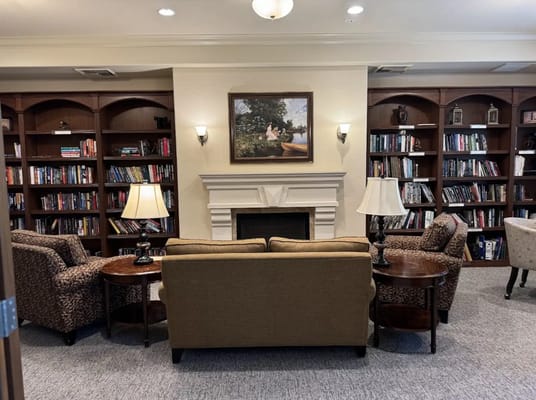 Cozy reading area with bookshelves and seating