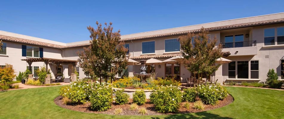 Beautiful landscaped courtyard with seating and umbrellas