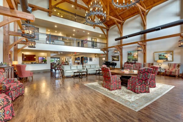 Bright, spacious common area with seating and decorative elements