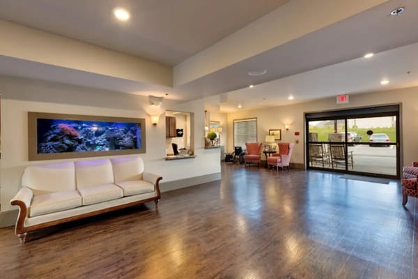 Interior common area with seating and a fish tank