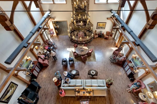 Interior view of a common area with residents and staff