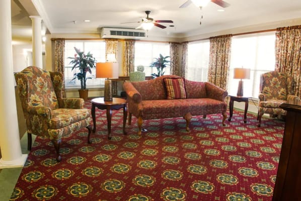 Cozy common area with patterned upholstery and light fixtures