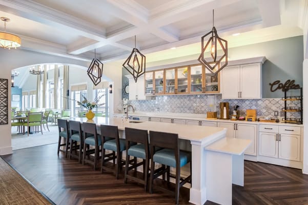 Bright common area with large windows and seating