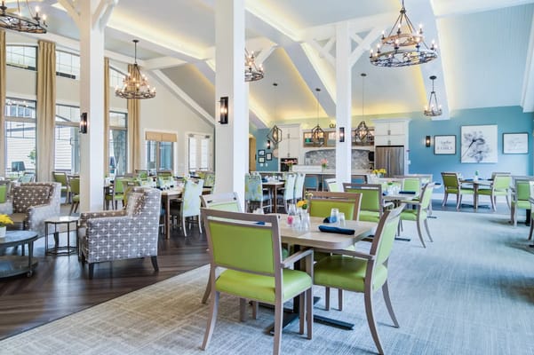 Bright dining room with colorful seating and decor